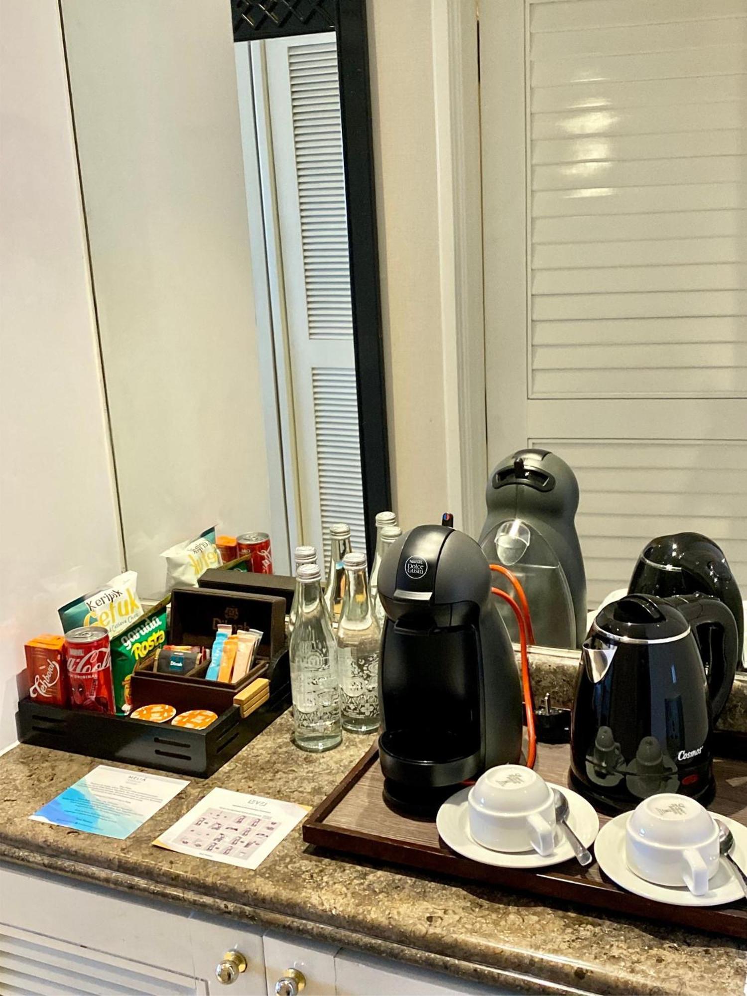 Melia Purosani Yogyakarta Hotel Exterior photo A Nespresso coffee machine in a hotel room